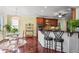 Bright eat-in kitchen with stainless appliances, wood floors, and a breakfast bar, perfect for casual dining at 3704 Wilkins Cir, Powder Springs, GA 30127