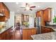Well-equipped kitchen with granite countertops, stainless steel appliances, and custom cabinets at 3704 Wilkins Cir, Powder Springs, GA 30127