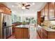 Beautiful kitchen featuring custom cabinetry, granite countertops, stainless steel appliances, and center island at 3704 Wilkins Cir, Powder Springs, GA 30127