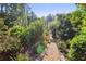 Beautifully landscaped yard with gravel paths winding through lush greenery and colorful flower beds at 3704 Wilkins Cir, Powder Springs, GA 30127