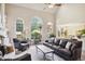 This spacious living room is filled with light from the large windows and is anchored by a beautiful fireplace at 3704 Wilkins Cir, Powder Springs, GA 30127