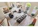 Spacious living room with high ceilings, fireplace, built-in shelves, and floor to ceiling windows at 3704 Wilkins Cir, Powder Springs, GA 30127