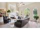 Inviting living room boasts fireplace, built-in shelving, stylish furniture, and great natural lighting at 3704 Wilkins Cir, Powder Springs, GA 30127