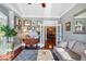 Inviting living room with hardwood floors, stylish rug, and ample natural light, offering a cozy retreat at 3704 Wilkins Cir, Powder Springs, GA 30127