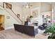 A large living room featuring stairs, tile floors, built-in shelves, fireplace and large ceilings at 3704 Wilkins Cir, Powder Springs, GA 30127