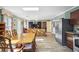 Open-concept living space with a dining area, kitchen, and comfortable seating arrangement at 3704 Wilkins Cir, Powder Springs, GA 30127