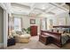 Relaxing bedroom with a cozy chair, coffered ceilings, and an upholstered bed at 3704 Wilkins Cir, Powder Springs, GA 30127