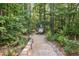 Peaceful wooded path leading to a statue, framed by lush greenery at 3704 Wilkins Cir, Powder Springs, GA 30127