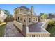 Exterior shot of backyard featuring a beautiful deck, patio, and landscaped lawn at 877 Ashwood Walk, Decatur, GA 30030