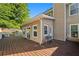 Expansive backyard deck featuring access to the home's sunroom, perfect for outdoor living at 877 Ashwood Walk, Decatur, GA 30030