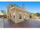 Spacious backyard deck with access to sunroom and a stone-paved patio at 877 Ashwood Walk, Decatur, GA 30030