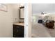 Half bath with granite countertop and an adjacent view of the living room with fireplace at 877 Ashwood Walk, Decatur, GA 30030