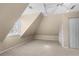 Unique attic bedroom space with dormer windows, built-in shelving, and a cozy atmosphere at 877 Ashwood Walk, Decatur, GA 30030