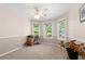 Versatile bonus room bathed in natural light with multiple windows, ideal for a home office or hobby space at 877 Ashwood Walk, Decatur, GA 30030