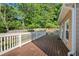 Spacious wooden deck with white railing, ideal for outdoor entertaining and relaxing in the backyard at 877 Ashwood Walk, Decatur, GA 30030