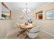 Cozy dining area with chandelier lighting and views into the living area at 877 Ashwood Walk, Decatur, GA 30030