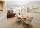 Cozy dining area with chandelier lighting and views into the living area at 877 Ashwood Walk, Decatur, GA 30030