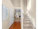 Bright, two-story foyer with hardwood floors and a staircase at 877 Ashwood Walk, Decatur, GA 30030