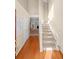 Bright, two-story foyer with hardwood floors leading into a carpeted living space at 877 Ashwood Walk, Decatur, GA 30030