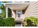 Inviting front porch with decorative glass door framed by manicured greenery at 877 Ashwood Walk, Decatur, GA 30030