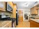 Bright kitchen featuring stainless steel appliances, wood cabinets, and hardwood floors at 877 Ashwood Walk, Decatur, GA 30030