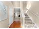 Inviting home entryway featuring a staircase with carpet steps and wood flooring at 877 Ashwood Walk, Decatur, GA 30030