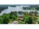 Expansive aerial view of the lake house on a large lot with lake views at 3865 Adams Rd, Cumming, GA 30041