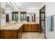 Bathroom with single sink, spacious cabinets, marble counter tops, and glass shower at 3865 Adams Rd, Cumming, GA 30041