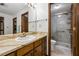 Classic bathroom with single sink, marble countertop, and walk-in shower at 3865 Adams Rd, Cumming, GA 30041