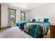 Bright bedroom with two twin beds and green bedding near window at 3865 Adams Rd, Cumming, GA 30041