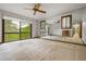Large bedroom with mirrored wall, a ceiling fan, and sliding door to the deck at 3865 Adams Rd, Cumming, GA 30041