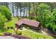 Charming single-Gathering home featuring a lush front yard, mature trees and a winding pathway at 3865 Adams Rd, Cumming, GA 30041