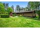 Well-maintained single-story home featuring lovely landscaping and a welcoming entrance with a walkway at 3865 Adams Rd, Cumming, GA 30041