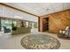 Inviting living room with stone accent, wood walls, and a comfortable seating area at 3865 Adams Rd, Cumming, GA 30041