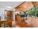 Spacious living room with a breakfast bar, wood accents, and large windows offering scenic views at 3865 Adams Rd, Cumming, GA 30041