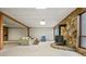 Cozy living room featuring a charming wood burning stove and beautiful stone accent wall at 3865 Adams Rd, Cumming, GA 30041