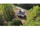 Aerial view of a well-maintained home with a private backyard surrounded by mature trees at 645 Woodwind Dr, Rockmart, GA 30153