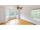 A serene bedroom boasts abundant natural light and gleaming hardwood floors at 645 Woodwind Dr, Rockmart, GA 30153
