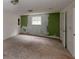 Spacious bedroom with carpet, window, and painted green accent wall at 645 Woodwind Dr, Rockmart, GA 30153