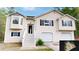 Charming two-story home featuring a two-car garage, bay windows, and traditional design at 645 Woodwind Dr, Rockmart, GA 30153