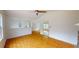 Open living room with hardwood floors, a view of a staircase, and white walls at 645 Woodwind Dr, Rockmart, GA 30153