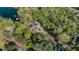 Expansive estate nestled among dense trees, offering privacy and serenity in a secluded setting at 7305 Breeze Bay Rd, Cumming, GA 30041