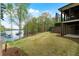 Expansive backyard sloping to lake with tiered landscaping at 7305 Breeze Bay Rd, Cumming, GA 30041