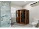 Modern bathroom features glass enclosed shower and elegant wooden sauna at 7305 Breeze Bay Rd, Cumming, GA 30041