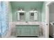 Stylish bathroom with double vanity and unique details at 7305 Breeze Bay Rd, Cumming, GA 30041