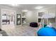 Bedroom with built-in bunk beds, beanbag chairs and adjacent billiard room at 7305 Breeze Bay Rd, Cumming, GA 30041