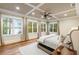 This bedroom is bright and spacious with lots of windows and recessed lights at 7305 Breeze Bay Rd, Cumming, GA 30041