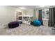 Cozy bedroom featuring built-in bunk beds and stylish beanbag chairs at 7305 Breeze Bay Rd, Cumming, GA 30041