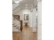 Bright hallway with hardwood floors, white trim, and a staircase to the left at 7305 Breeze Bay Rd, Cumming, GA 30041
