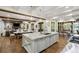 Open-concept kitchen with center island and granite countertops, connected to dining and living spaces at 7305 Breeze Bay Rd, Cumming, GA 30041